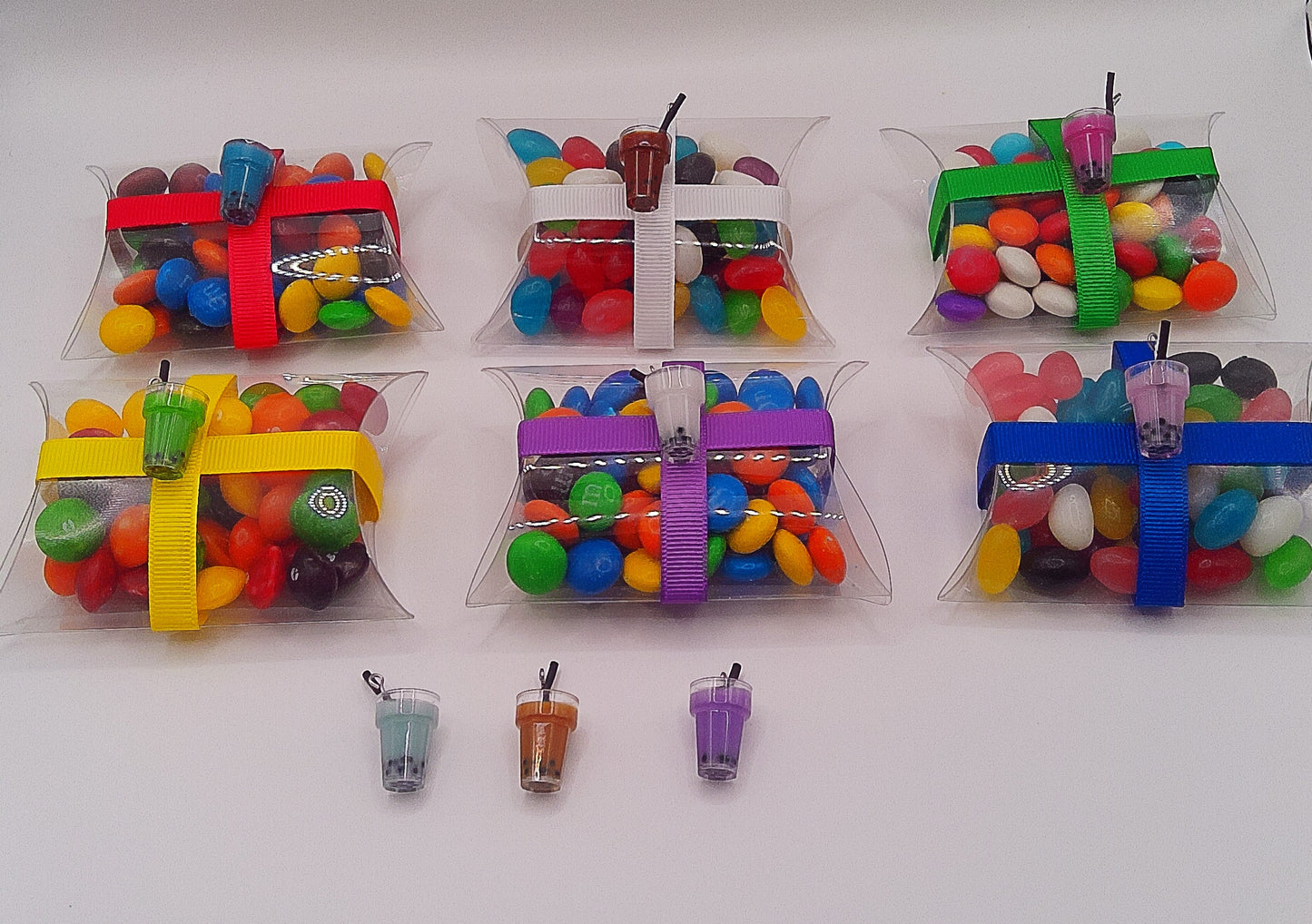 Bubble tea charm and clear pillow shaped box filled with lollies