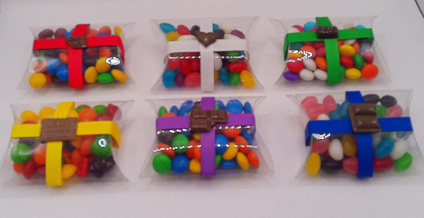 Chocolate charm and clear pillow shaped box filled with lollies