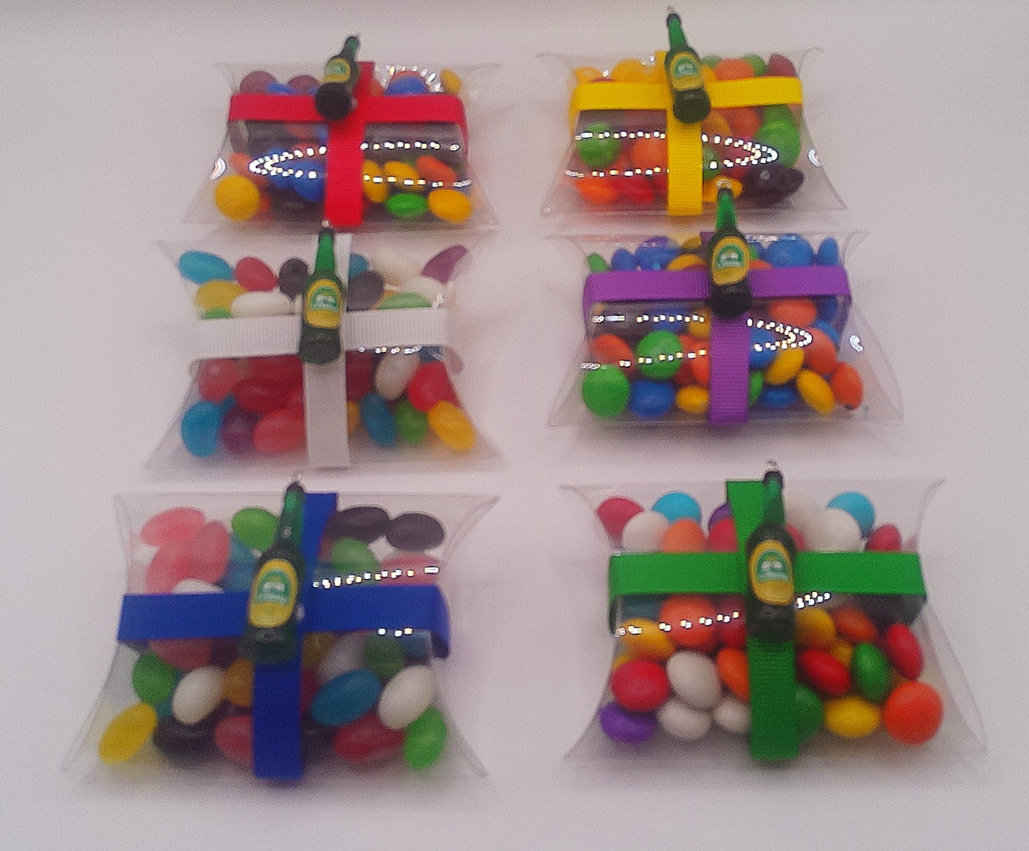 Beer bottle charm and clear pillow shaped box filled with lollies