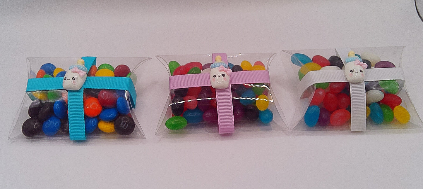 Baby bottle charm and clear pillow shaped box filled with lollies
