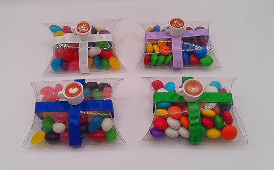 Cappuccino charm and clear pillow shaped box filled with lollies