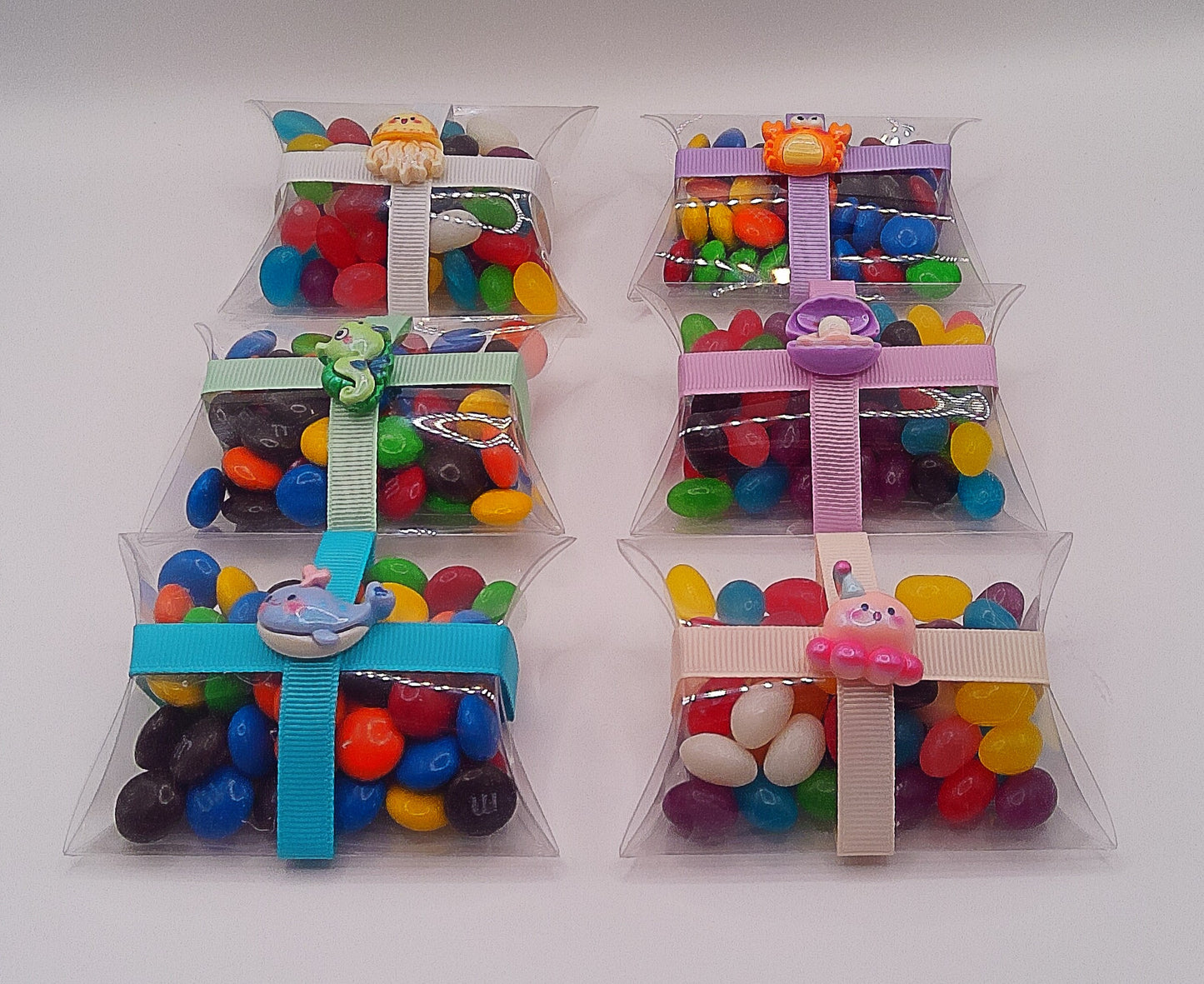 Under the sea charm and clear pillow shaped box filled with lollies