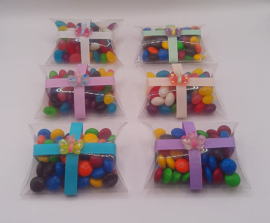 Butterfly charm with clear pillow shaped box filled with lollies