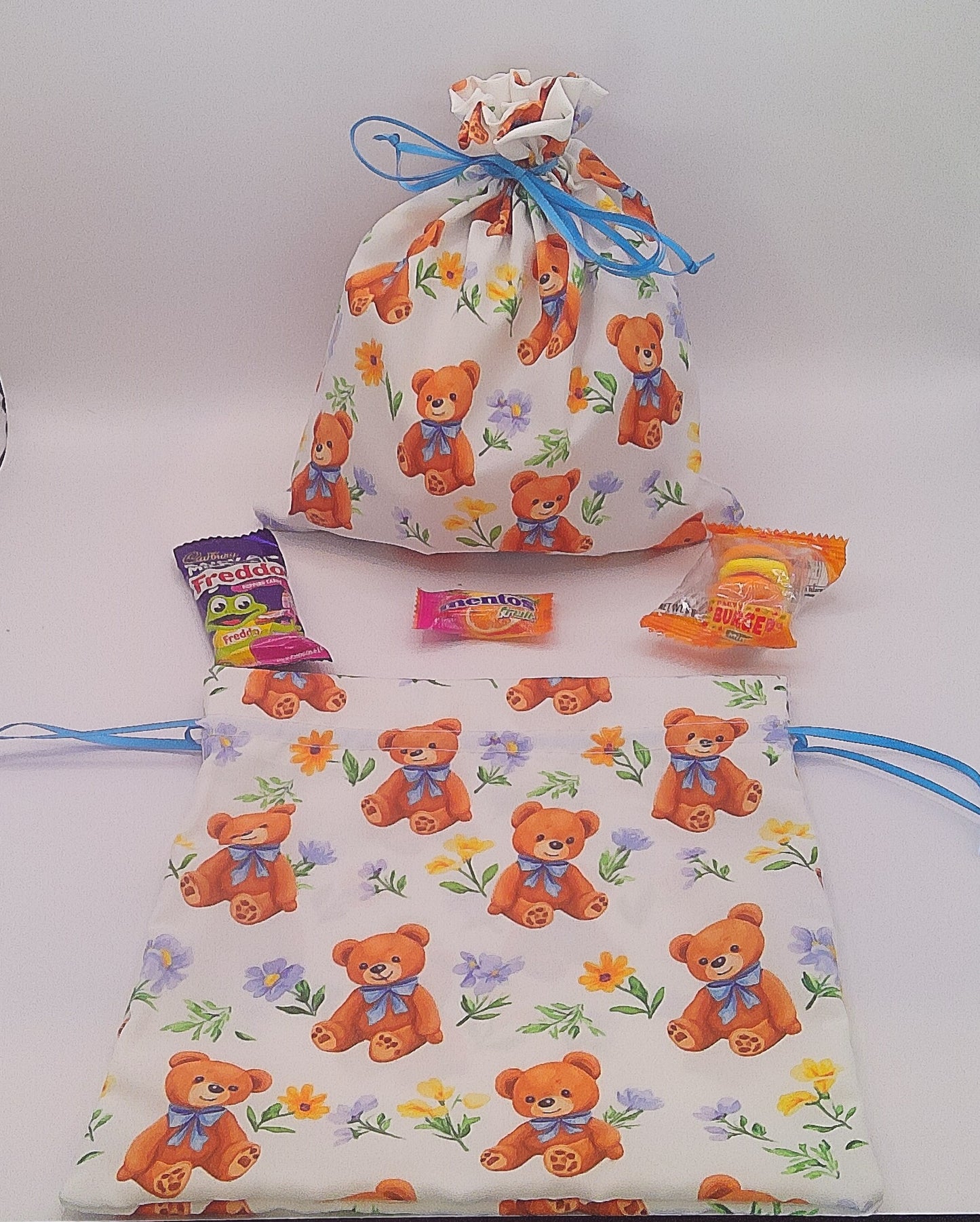 Teddy bear with blue bow material drawstring party favour bags