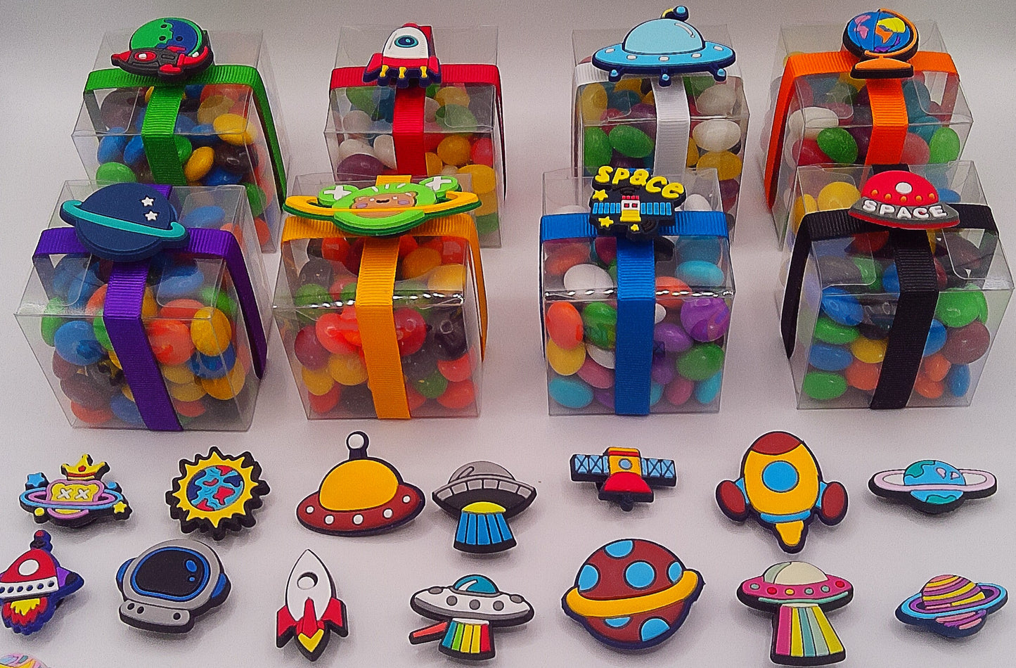 Space themed shoe charms with clear box of lollies