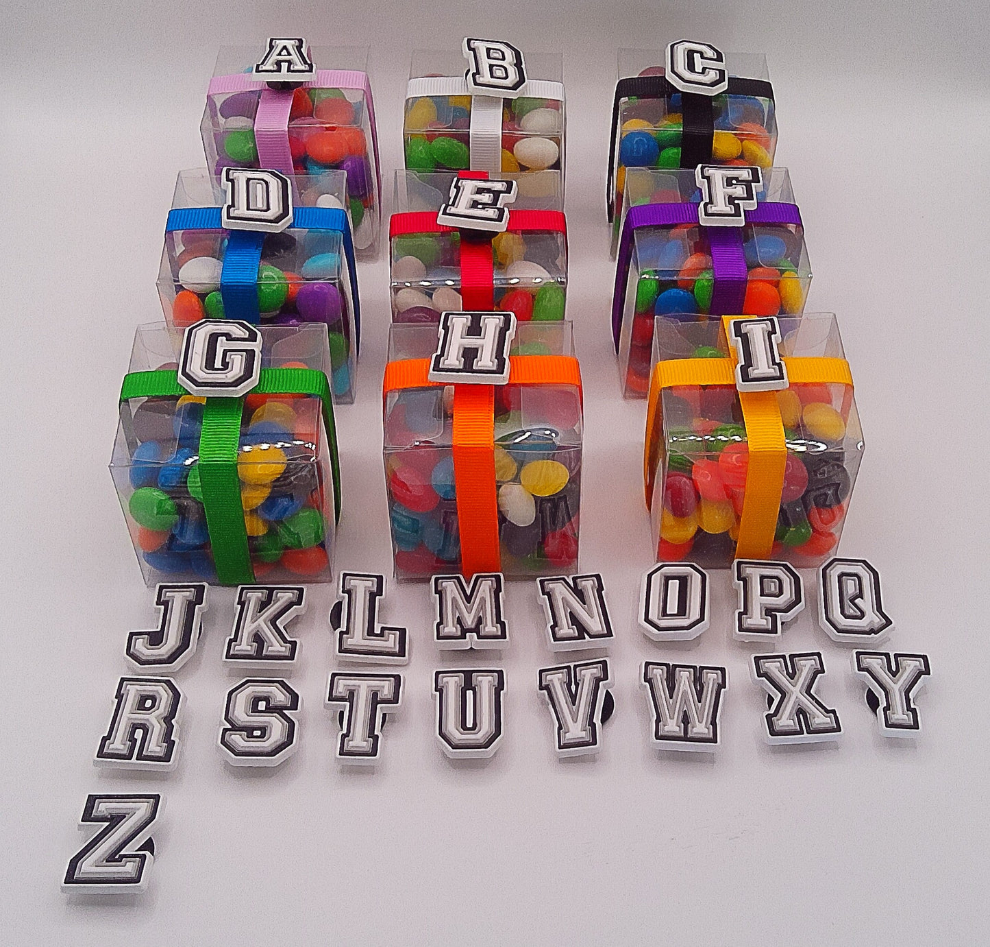 Alphabet shoe charms pink or white with clear box of lollies